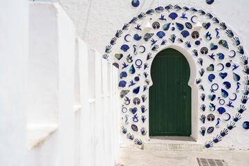 decorated door and tourists, Asilah, morocco, africa