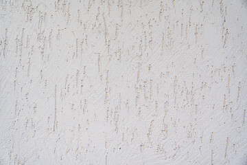 The surface of the wall with the texture of decorative plaster. 