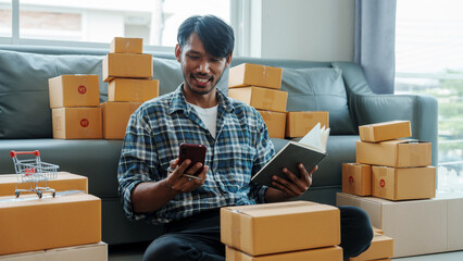 Mixed race Asian indian ethnicity young man chinese transport shipment delivery service sme parcel cardboard box package on delivery small business owner SME, shopping online