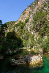 hikers bathing in the river, God's Bridge, Akchour, Talassemtane Nature Park, Rif region, morocco, africa
