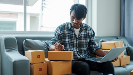 Mixed race Asian indian ethnicity young man chinese transport shipment delivery service sme parcel...