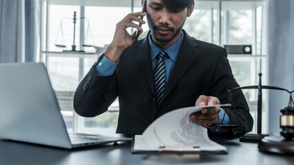 Portrait of successful mixed race asian indian chinese handsome businessman lawyer closes the deal with the client concepts of law, advice, legal services.