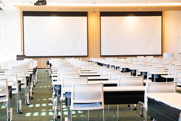 inside academic classroom with desk and projector