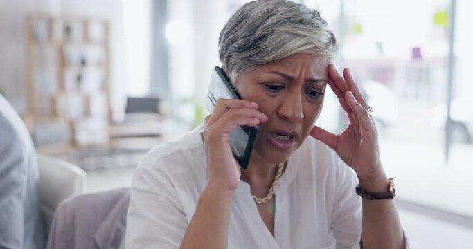 Business woman, phone call and frustrated in consulting, customer service or telemarketing at office. Annoyed or upset female consultant agent talking on smartphone to difficult client at workplace