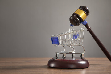 Judge gavel with a shopping cart.