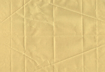 Beige textured paper sheet with geometric folds