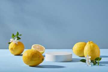 Minimal scene of a white podium in round shape decorated with several Lemons and small white...