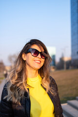 Portrait of a young woman in sunglasses.