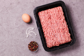 Frozen minced meat in package with spices
