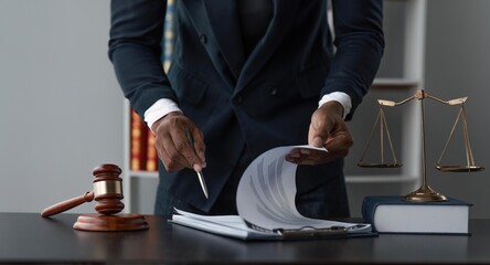 Male lawyer working at table in office