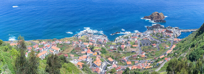 Panoramic aerial view at the Porto Moniz village , full view at the main settlement of Porto Moniz and ilhéu Mole, Madeira Island, Portugal