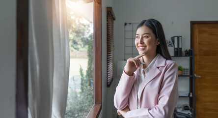 Fototapeta premium Asian businesswoman smile in office happy and cheerful