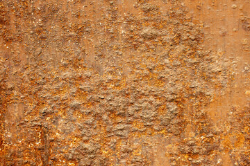 Rust of metals.Corrosive Rust on old iron with a hole. Rusted orange painted metal wall.