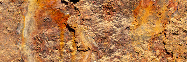 Rust of metals.Corrosive Rust on old iron with a hole. Rusted orange painted metal wall.