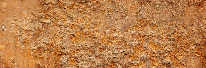 Rust of metals.Corrosive Rust on old iron with a hole. Rusted orange painted metal wall.