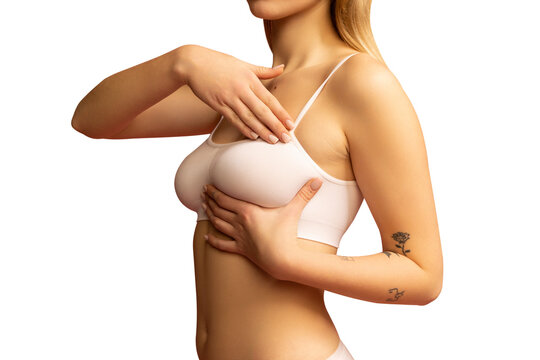 Cropped image of female body, breast in white underwear isolated over transparent background png. Mammoplasty, health, medicine exam concept.