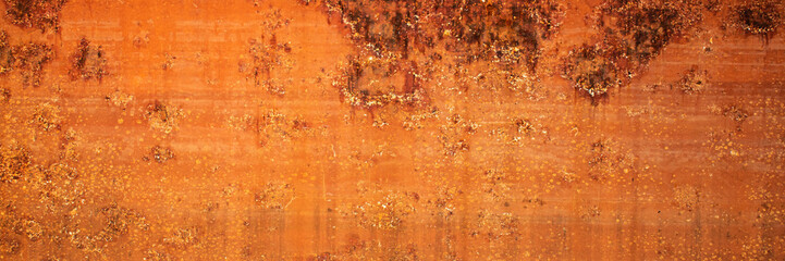Rust of metals.Corrosive Rust on old iron with a hole. Rusted orange painted metal wall.