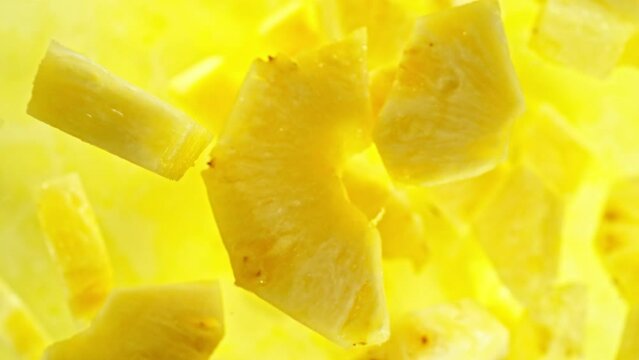 Super slow motion of rotating pineapple slices, top view. Filmed on high speed cinema camera, 1000 fps, placed on high speed cine bot, following the target.