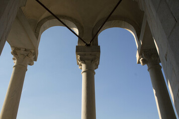 evocative image of a detail of the leaning tower of Pisa in the square
of Miracles under a clear sky