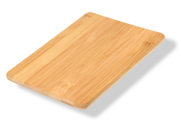 Wooden empty cutting board at an angle on a white background, kitchen utensils
