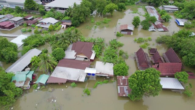 High-angle view of the Great Flood, Meng District, Thailand, on October 3, 2023, is a photograph from real flooding. With a slight color adjustment