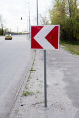 Road turn warning traffic sign on the road