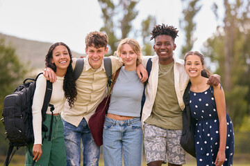 Portrait Of Multi-Cultural Secondary Or High School Students Hugging Outdoors