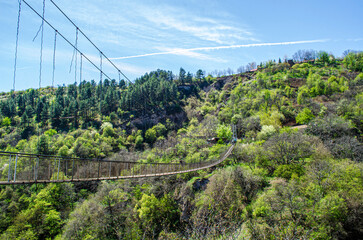 Fototapeta na wymiar suspension bridge in the mountains