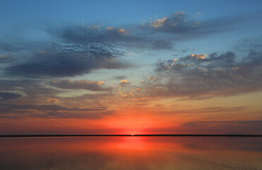 hot sunset over lake
