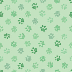 Fototapeta na wymiar Green colored paw prints seamless fabric design