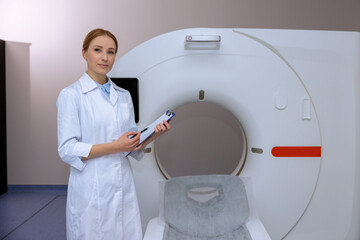 Female doctor in magnetic resonance imaging or computed tomography room of a modern hospital