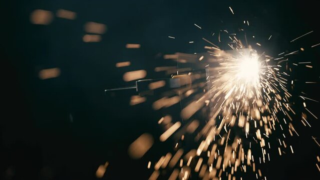 Slow motion: laser cutting, working with a metal workpiece with sparks in a factory. Metalworking, machining, industry, equipment, technology, production concept