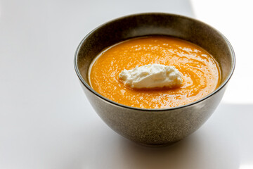 carrot soup on white background close up