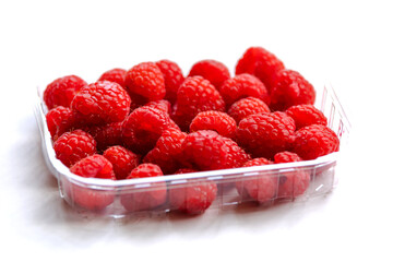 close up fresh raspberries on white background