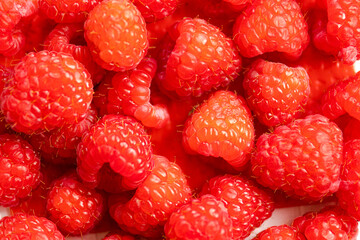 close up fresh raspberries on white background