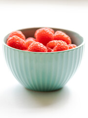 close up fresh raspberries on white background