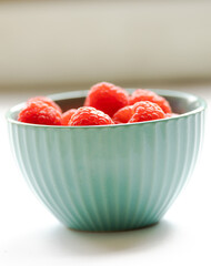 close up fresh raspberries on white background