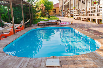 A small outdoor pool in hotel with limited space. 
