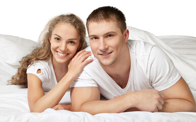 Obraz na płótnie Canvas Young couple in bed isolated on white background