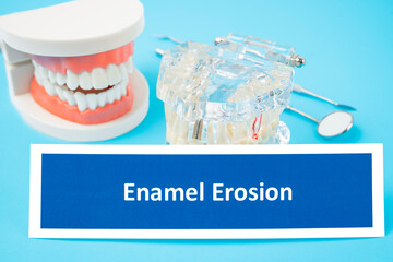 The Teeth model and Enamel Erosion dental disease with tools dental on blue background.