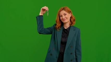 Excited woman first time homebuyer on green screen background. Female holding bunch of keys in her right hand green screen.