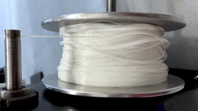 Winding threads on an industrial winder