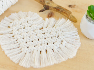 Macrame handmade napkin in the form of heart. Eco diy home decoration. Natural materials, cotton thread. St. Valentine's Day.