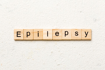 epilepsy word written on wood block. epilepsy text on table, concept