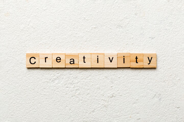 creativity word written on wood block. creativity text on cement table for your desing, concept