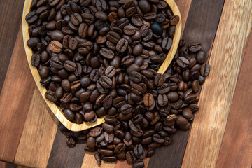 coffee beans in heart-shaped tra,y representing love of coffee