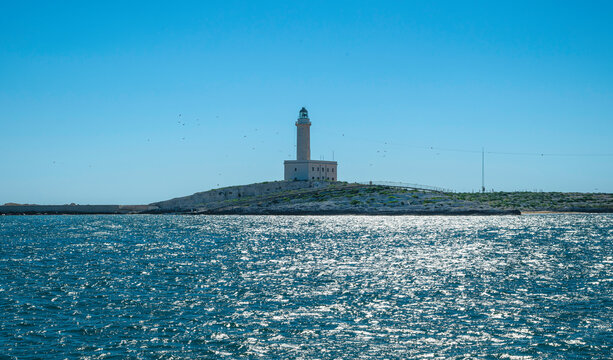 view of the lighthouse of Vieste situated on an island on the Gargano Peninsula in Italy