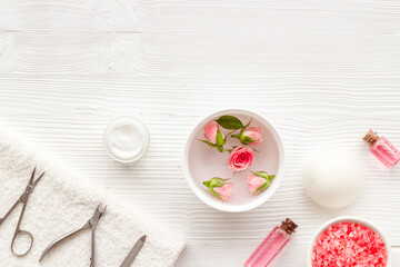 Hands and nail care spa set with pink roses flowers. Beauty care salon spa.