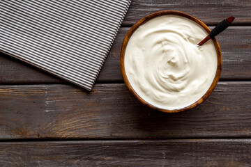 Dairy product - sour cream or yogurt in wooden bowl