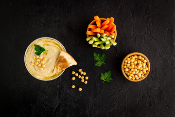 Chickpea hummus with vegetables sticks and pita croutons